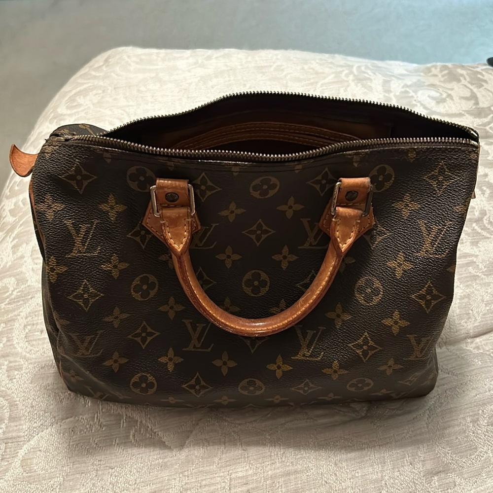 Genuine Louis Vitton bag 11” wide X 10” height